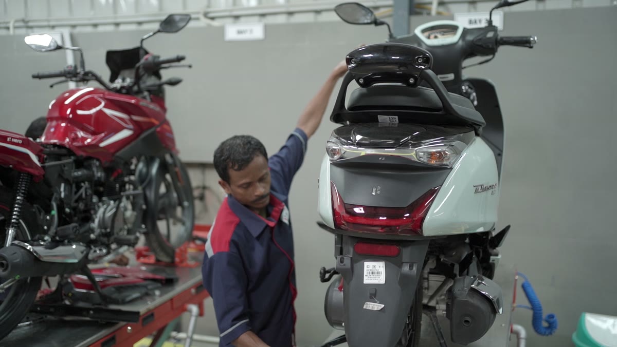 Technician checking a motorcycle
